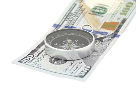 compass on 100 dollars banknote over whiteの写真素材