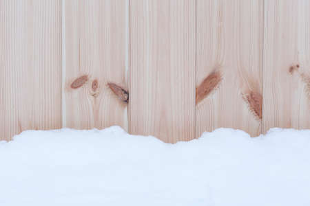snow over wooden wall backgroundの写真素材
