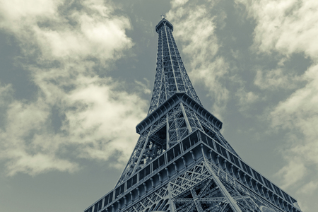 Eiffel tower in Paris against sky with cloudsの写真素材