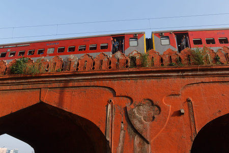 DELHI, INDIA - MARCH 13, 2018: train on old bridge near Red Fort, India