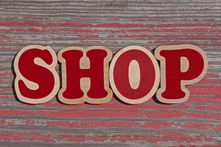 word shop made of wooden letters on aged wooden boardの写真素材