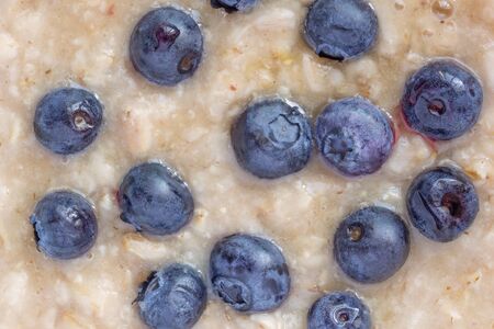 close up of oatmeal porridge with blueberriesの写真素材