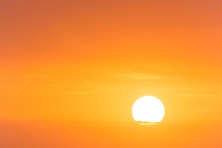 view on rising sun in picturesque skyの写真素材