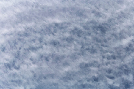 abstract natural background: blue sky covered with white fluffy clouds