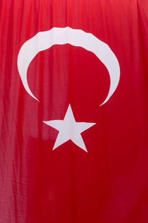 close up crescent and star on hanging Turkish flagの写真素材