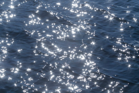 view of sunshine in blue waves of riverの写真素材