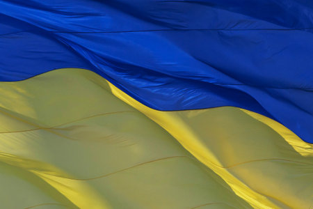close up of waved Ukrainian national flag
