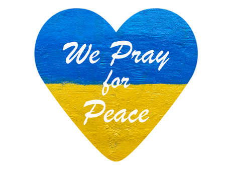 We pray for peace message on heart with Ukrainian flag isolated on whiteの写真素材