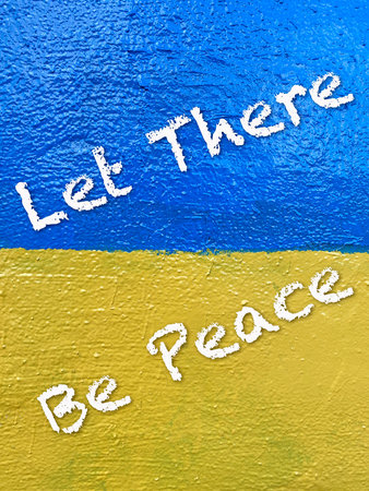 Stand with Ukraine: Let there be peace message on Ukrainian flag painted on wall