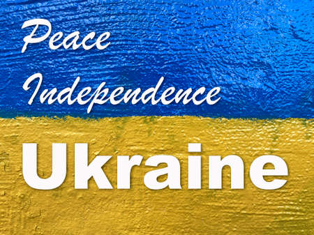 slogan Peace, Independence, Ukraine on Ukrainian flag painted on wallの写真素材