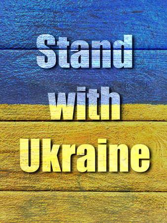 slogan Stand with Ukraine on Ukrainian flag painted on wooden wallの写真素材