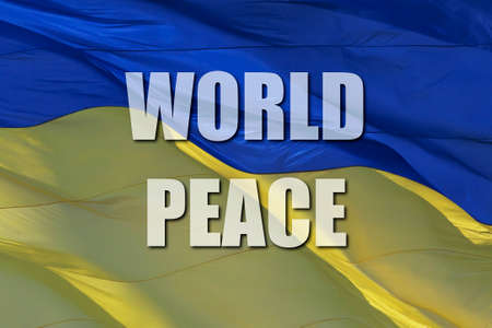 slogan World Peace on waved Ukrainian national flagの写真素材