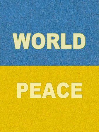 Stand with Ukraine: slogan World Peace on cardboard painted as Ukrainian flagの写真素材