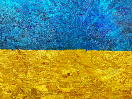 Stand with Ukraine backdrop: Ukrainian flag painted on wooden wallの写真素材