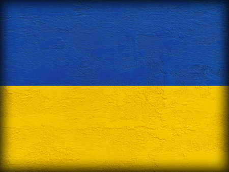 Stand with Ukraine: Ukrainian flag painted on stone wallの写真素材