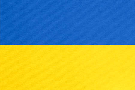 Stand with Ukraine backdrop: Ukrainian flag painted on cardboardの写真素材