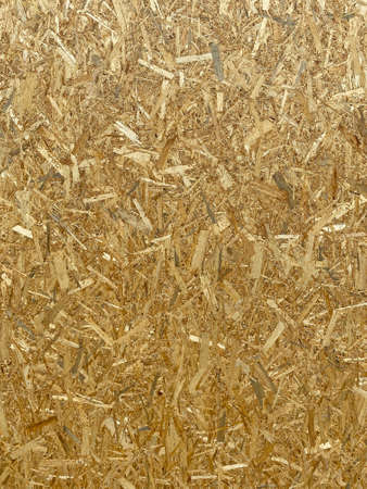 abstract background: compressed wooden board made of splintersの写真素材