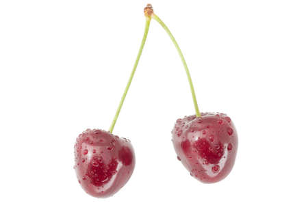 couple of wet red cherries isolated on white backgroundの写真素材
