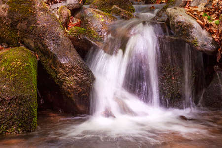 view on waterfall on a brook in Carpathian mountainsの写真素材