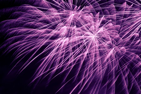 abstract holiday background: close up of violet fireworks in night skyの写真素材