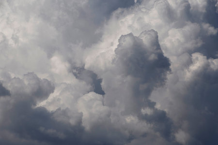 close up of  gray fluffy rain clouds in a sky