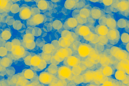 abstract holiday backdrop: bright bokeh background colored in colors of Ukrainian flagの写真素材