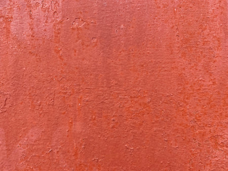 close up of metallic wall painted in red colorの写真素材