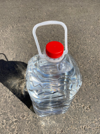 plastic bottle of water standing on roadの写真素材