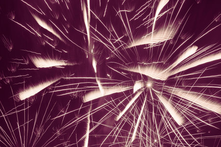 abstract holiday background: bright fireworks against violet backgroundの写真素材