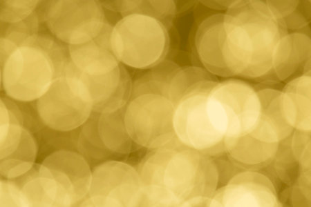 abstract holiday background: golden color bokeh circlesの写真素材