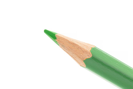 close up of tip of green wooden pencil isolated on white backgroundの写真素材