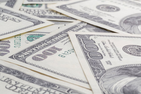 close up of heap of  one hundred US dollars banknotesの写真素材