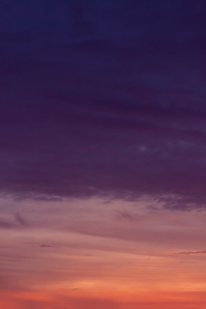 view on dark blue clouds in sky at sunsetの写真素材