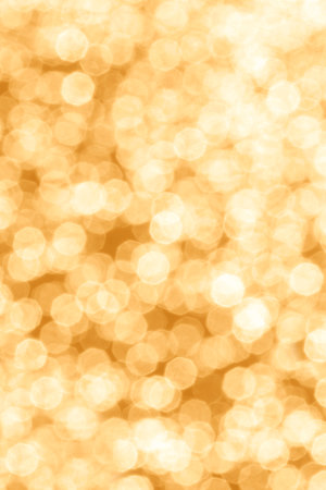 abstract holiday backdrop: close up of yellow bokeh backgroundの写真素材