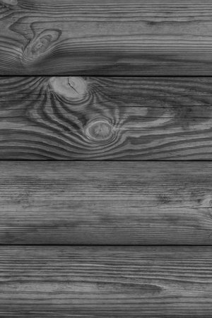 black and white photo of wooden wall made of planks backgroundの写真素材
