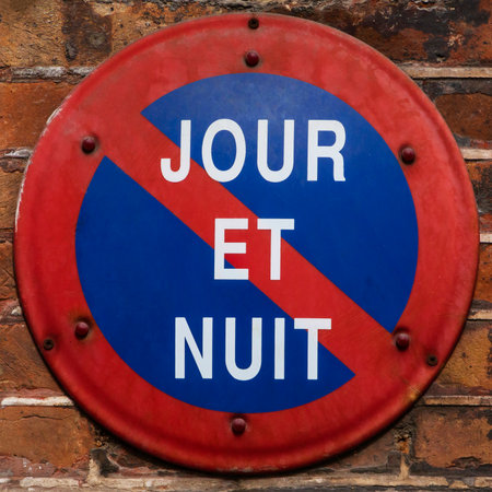 No waiting sign hanging on wall of building in Parisの写真素材