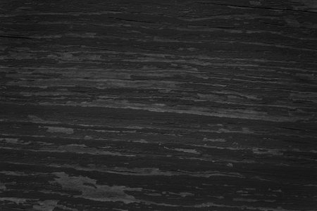 black and white photo of dark old shabby wooden boardの写真素材