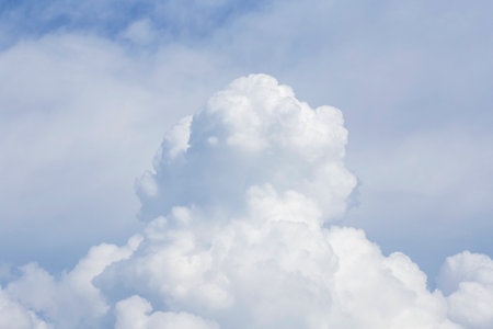 close up of white fluffy rain cloud in a skyの写真素材