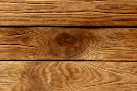 light brown wooden wall made of planks backgroundの写真素材