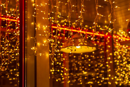 view on lights in window of cafe at Christmasの写真素材