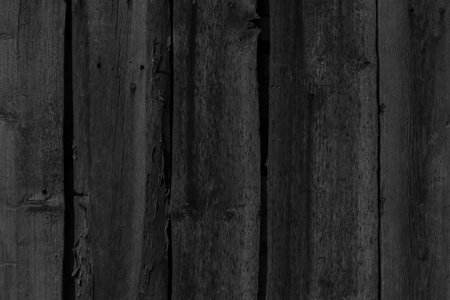 black and white photo of old rural wooden fence made of boardsの写真素材