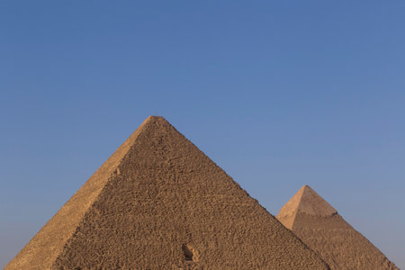 view on Great pyramid and pyramid of Khafre in Giza against clear blue skyの写真素材