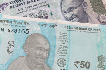 close up of one hundred and fifty Indian rupee banknotes