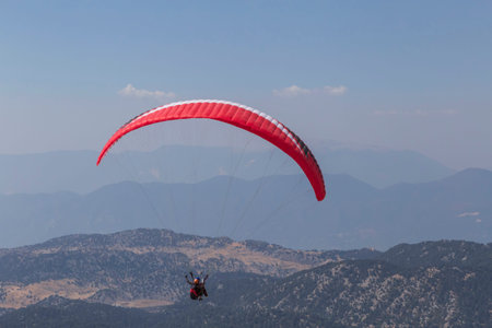 view on paraglider flying in mountains in Turkey