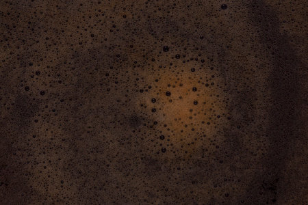 close up of foam on coffee drink backgroundの写真素材