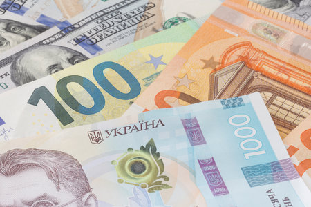 close up of one thousand Ukrainian hrivnya banknote lying on euro and dollars banknotesの写真素材