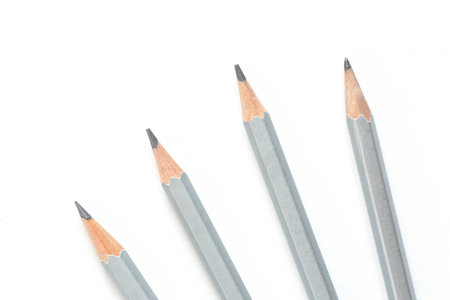 four crayon pencils isolated on white backgroundの写真素材