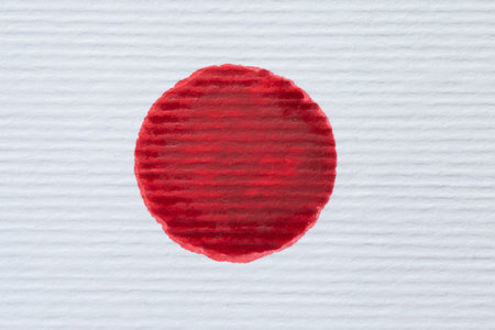 Japanese flag painted on striped watercolor paperの写真素材