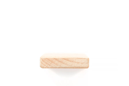 showcase for one item: wooden shelf over white backgroundの写真素材