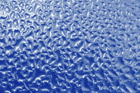 abstract blue natural background: close up of frozen windowの写真素材